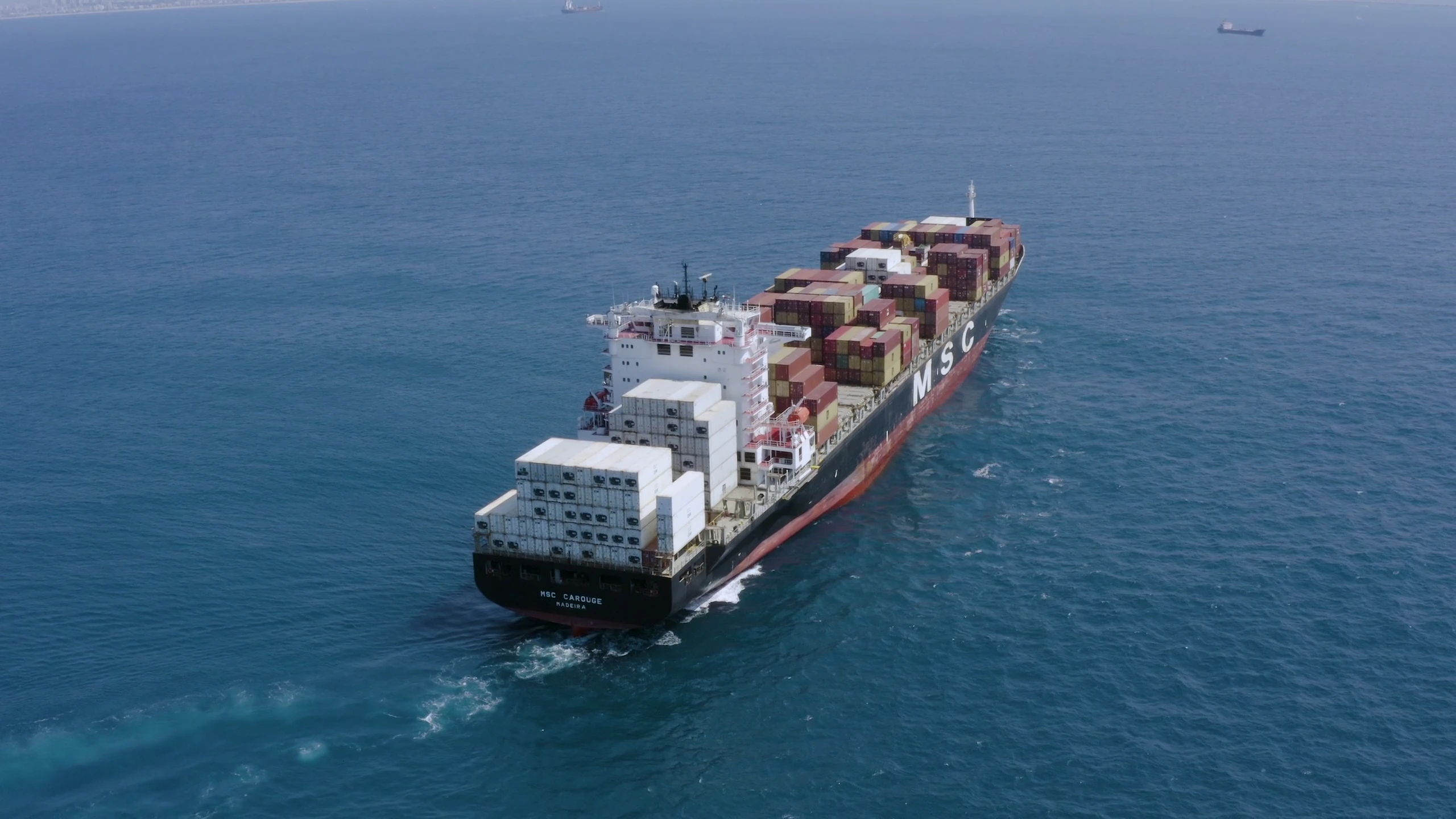Cargo vessel at sea viewed from above
