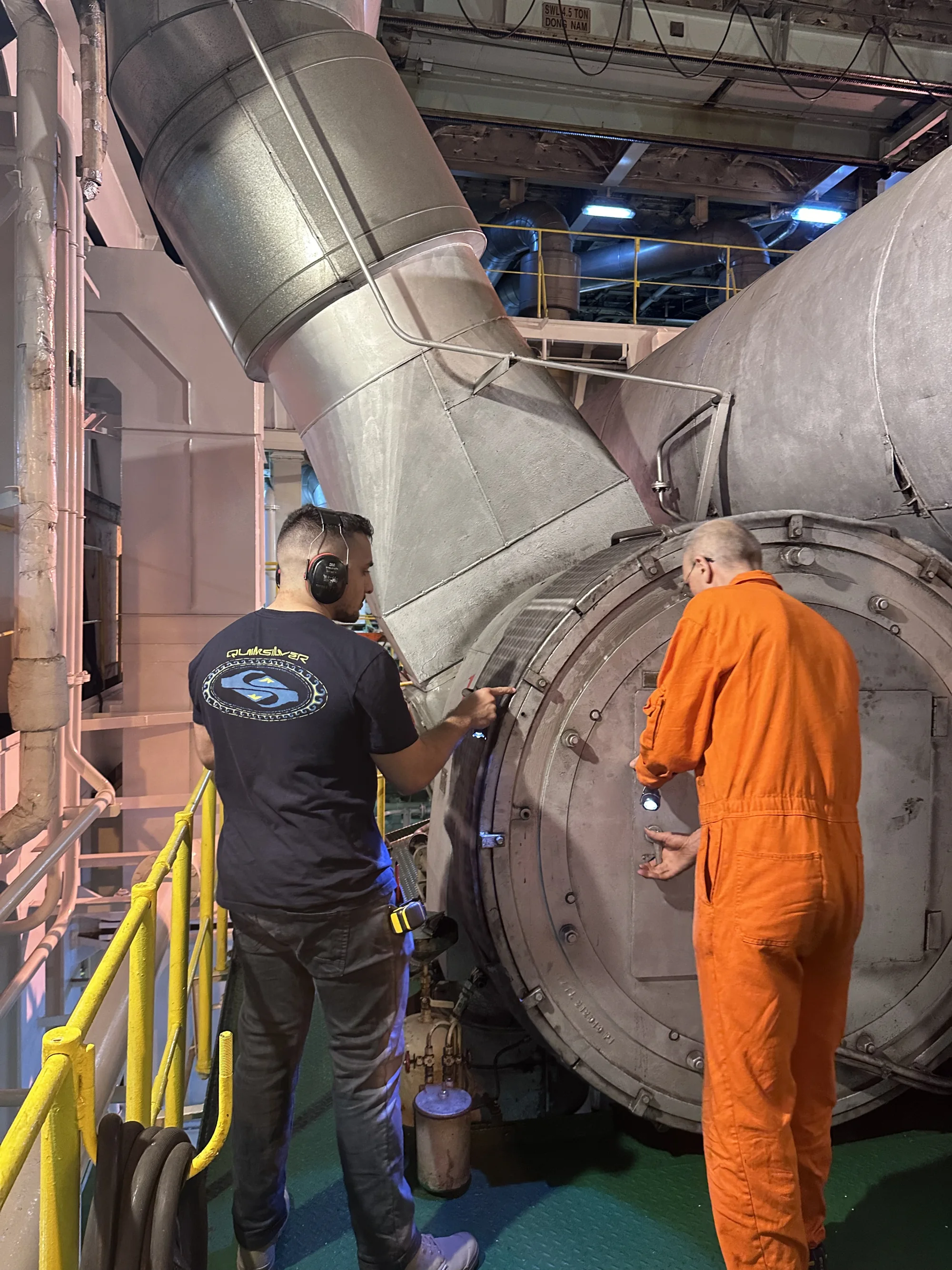 Newlight engineers working together on a marine engine